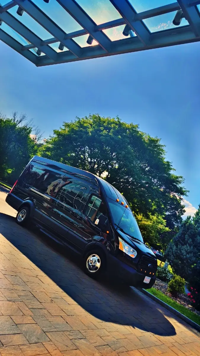 Black high-roof executive passenger van